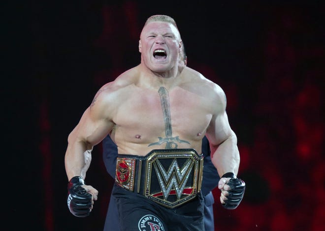 FILE - In this March 29, 2015, file photo, Brock Lesnar makes his entrance at Wrestlemania XXXI in Santa Clara, Calif. WWE is set to hold its Crown Jewel event Friday, Nov. 2, 2018, in Riyadh, Saudi Arabia. The lucrative deal with Saudi Arabia has prompted fans and politicians to criticize WWE's decision to continue with the event. (AP Photo/Don Feria, File)