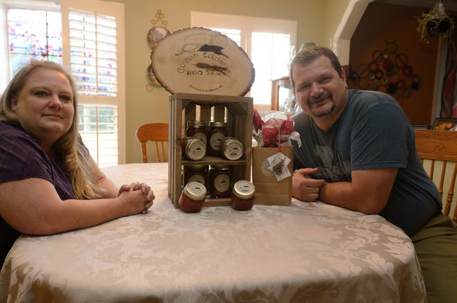Jennifer and Eddie Collins, who live in Wallburg, sell Cousin Eddie's Barbecue, which they say has a sweet, but spicy aftertaste. [Ben Coley/The Dispatch]