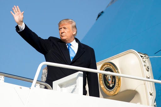 President Donald Trump waves as he boards Air Force One at Andrews Air Force Base, Md., Tuesday, Oct. 30, 2018, to travel to Pittsburgh following last weekends shooting at Tree of Life Synagogue. (AP Photo/Andrew Harnik)