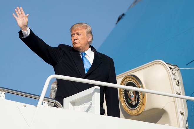 President Donald Trump waves as he boards Air Force One at Andrews Air Force Base, Md., on Tuesday to travel to Pittsburgh following last weekend's shooting at Tree of Life Synagogue. Trump says he wants to order the end of the constitutional right to citizenship for babies of noncitizens and unauthorized immigrants born in the United States. [Andrew Harnik/The Associated Press]