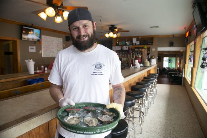 Brian Clark, manager of The Oyster Troff in Eustis, won the US National Oyster Shucking Championship two weeks ago and will represent the United States at the International competition in Ireland next year. [Cindy Sharp/Correspondent]