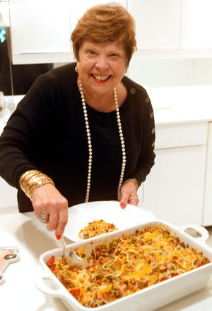 Sandra Hull dishes out her mother's baked spaghetti recipe.
