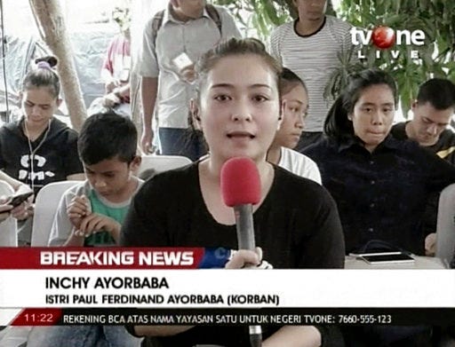 In this image from video, Inchy Ayorbaba, wife of missing passenger Paul Ferdinand Ayorbaba, speaks in a TV interview in Jakarta on Wednesday, Oct. 31, 2018. Indonesian TV broadcast a smartphone video by Paul Ferdinand Ayorbaba of passengers boarding Flight 610 on Oct. 29, its mundane details transformed into unsettling moments by knowledge of the tragedy that would transpire. "My husband sent that video to me via WhatsApp. It was his last contact with me, his last message to me," Inchy Ayorbaba said. (TV One via AP)