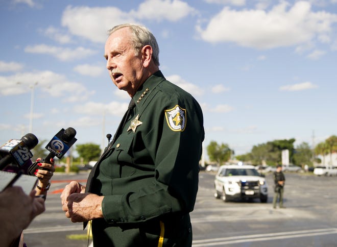 Sheriff Ric Bradshaw speaks to members of the media after part of the West Palm Plaza was closed off after a deputy-involved shooting on the southwest side of Forest Hill Blvd and Military Trail near Palm Springs Tuesday October 30, 2018. [Meghan McCarthy/palmbeachdailynews.com]