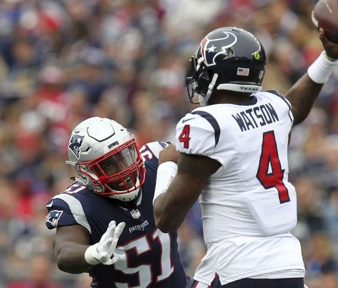 New England Patriots linebacker Ja'Whaun Bentley (51) pressures Houston Texans quarterback Deshaun Watson (4) during the second half of an NFL football game, Sunday, Sept. 9, 2018, in Foxborough, Mass.