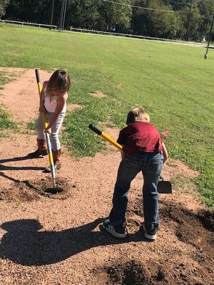 Bastrop YMCA members and supporters help ready the area for an outdoor fitness pod, which the organization will unveil on Saturday during a grand opening and family field day at Bob Bryant Park in Bastrop. [CONTRIBUTED PHOTO]