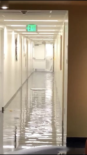 The Pavillions, a dorm at St. Edward's University, experienced significant flooding after a water line break on Thursday, Nov. 1, 2018, as this flooded hallways shows. Photo courtesy of Isabela Sanfeliz