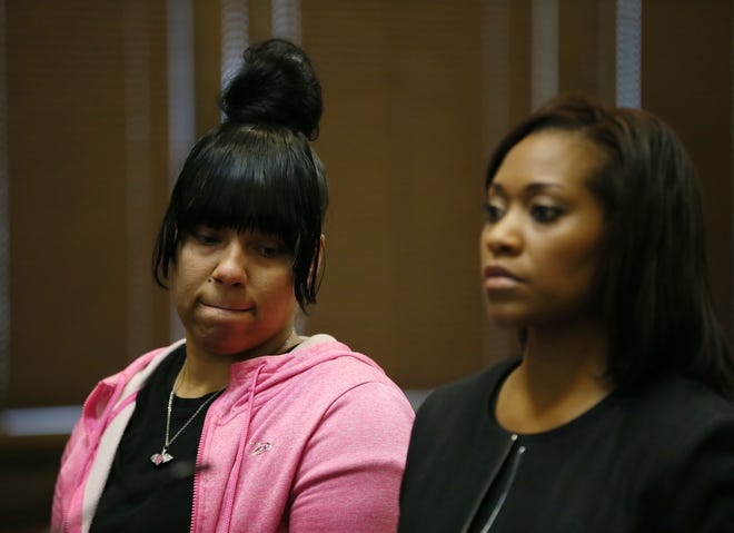 Tierra Williams looks to her attorney Kani Harvey Hightower after pleading guilty to child endangerment in the death of her daughter Wynter Parker, 2, in Summit County Common Pleas Court on Thursday. [Mike Cardew/Beacon Journal/Ohio.com]