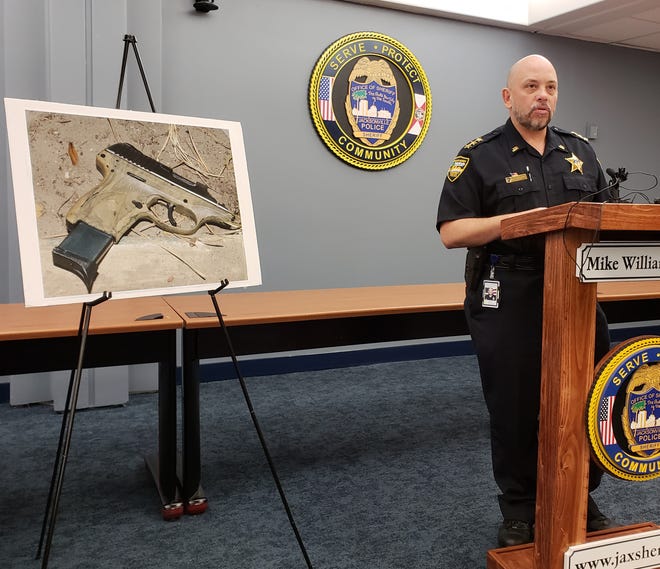Sheriff's Office Director Ron Lendvay discusses Jacksonville's second officer-involved shooting of 2018 at a Thursday news conference, standing next to an image of the Ruger semi-automatic handgun investigators believe was used in the carjacking that preceded the death of a 24-year-old suspect. [Dan Scanlan/Florida Times-Union]