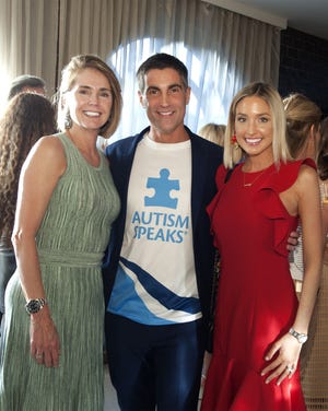 Sebastien Tribout, pictured with Maribel Alvarez and Brandy Billinghurst at the Autism Speaks NYC Marathon kickoff reception at Meat Market this fall, will run in the marathon Sunday for Autism Speaks. [Meghan McCarthy/palmbeachdailynews.com]