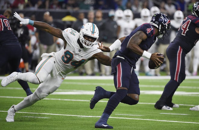 Texans quarterback Deshaun Watson is pressured by Dolphins defensive end Robert Quinn during their game last week in Houston. [ERIC CHRISTIAN SMITH/ASSOCIATED PRESS]