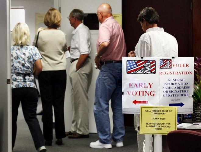 Voters wait to cast ballots at the Sarasota County Elections Office in downtown Sarasota during a previous early-voting period. [HERALD-TRIBUNE ARCHIVE]