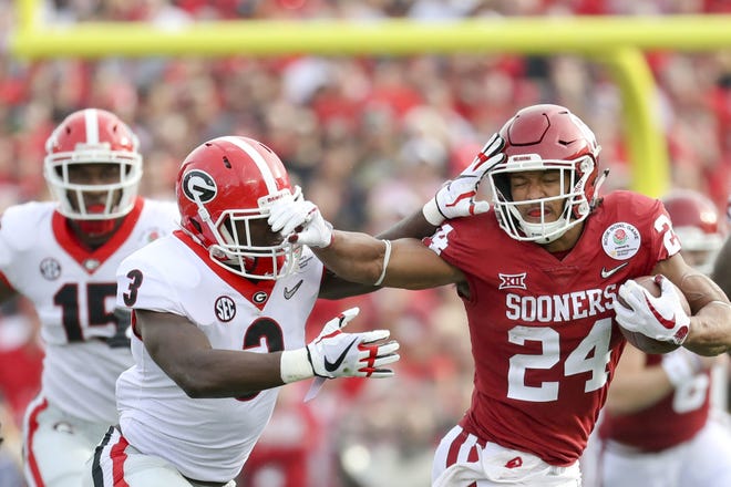 Oklahoma running back Rodney Anderson (right) announced Thursday that he had played his final game for the Sooners and will prepare for the NFL draft. He is rehabbing after the third season-ending injury in his four years at OU. IAN MAULE/Tulsa World