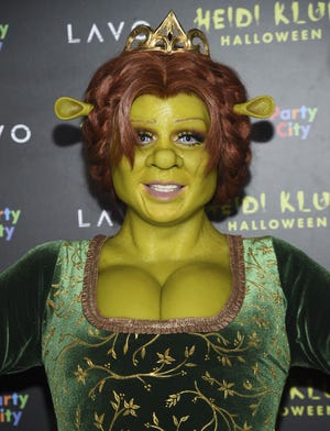 Model and television personality Heidi Klum dressed as the character Princess Fiona arrives at her 19th annual Halloween party at Lavo New York on Wednesday, Oct. 31, 2018, in New York. (Photo by Evan Agostini/Invision/AP)