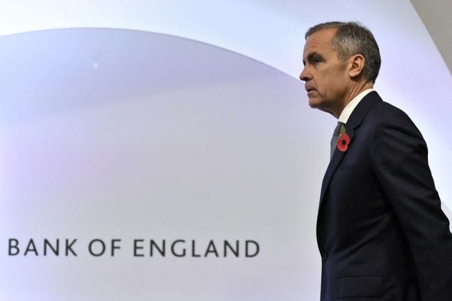 Bank of England Governor Mark Carney attends the Bank of England's inflation report press conference in the City of London, Thursday Nov. 1, 2018. (Kirsty O'Connor/Pool via AP)