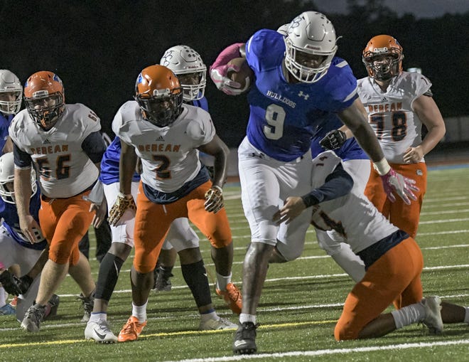 Mount Dora Christian Academy's Jesiah Pierre (9) leads the Bulldogs into the second round of the Sunshine State Athletic Conference playoffs. [PAUL RYAN / CORRESPONDENT]