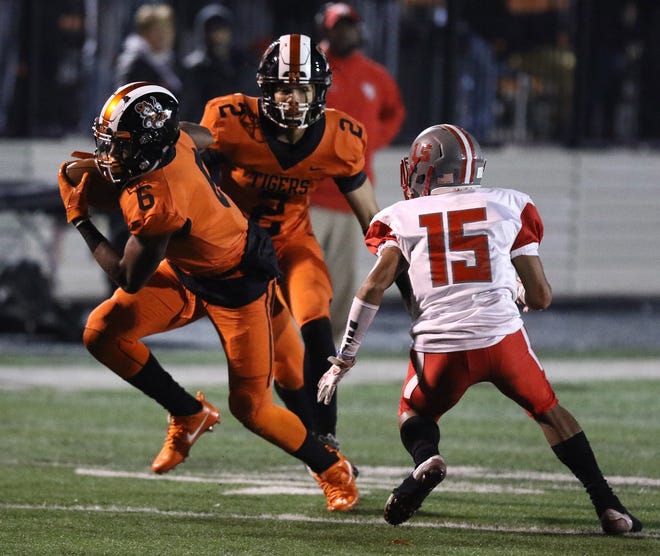 Massillon's Kyshad Mack has a pick-six in the first half after Walnut Ridges William Felts bobbled a reception. Massillon's Max Turner (2) was in on the play also.

 (IndeOnline.com / Kevin Whitlock)