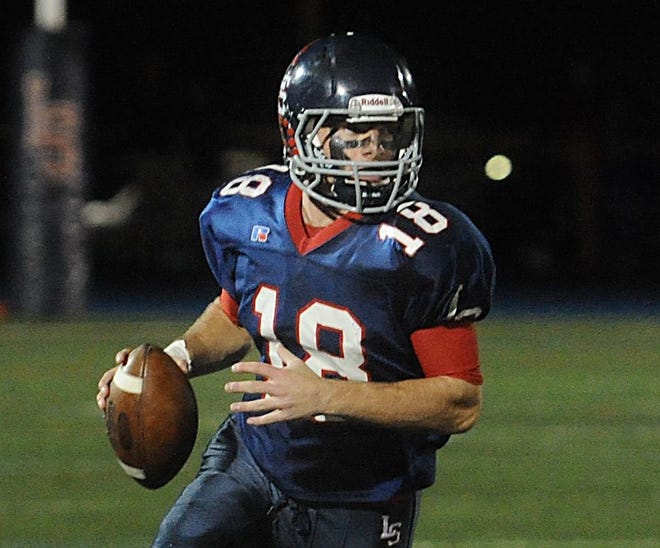 Lincoln-Sudbury senior quarterback Braden O'Connell threw a 79-yard touchdown pass to Cameron Anderegg with 11 seconds left in regulation to give the Warriors a 34-30 victory over Reading in the Division 2 North semifinals. [Daily News and Wicked Local Staff File Photo/Art Illman]