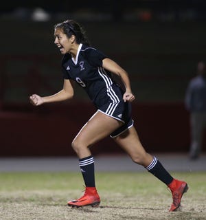 Niceville's Liliana Fernandez runs back to her waiting teammates after scoring the winning goal in a shootout against Navarre in the girls District 1-4A soccer championship at Pace. [MICHAEL SNYDER/DAILY NEWS]