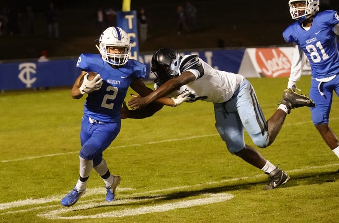 Northridge wide receiver CJ Jack Jr. (18) attempts to tackle Tuscaloosa County wide receiver De'Anthony Green (2) during Friday's game in Northport. [Photo/Jake Arthur]
