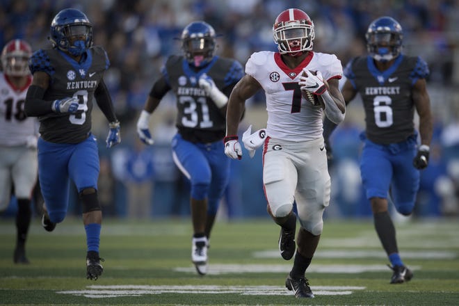 Georgia running back D'Andre Swift (7) runs for a touchdown during the second half of the Bulldogs' SEC East-clinching win. (AP Photo/Bryan Woolston)