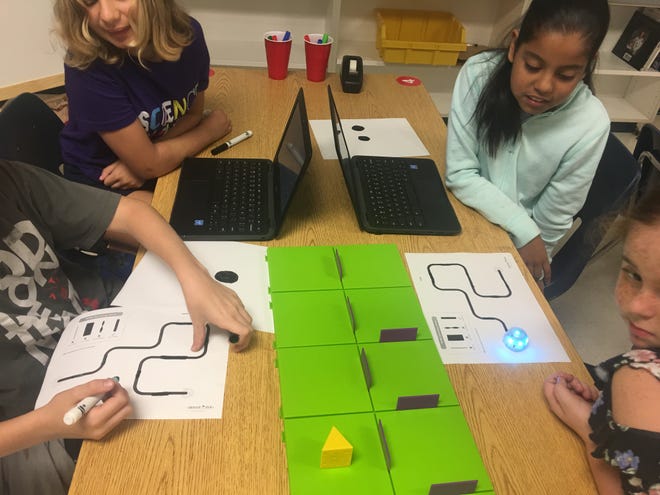 Students at Umatilla Elementary use Ozobot robots that can be programmed by art. The robots read colors so the students can create puzzles, roads, interactive stories and other artistic creations. [Submitted]