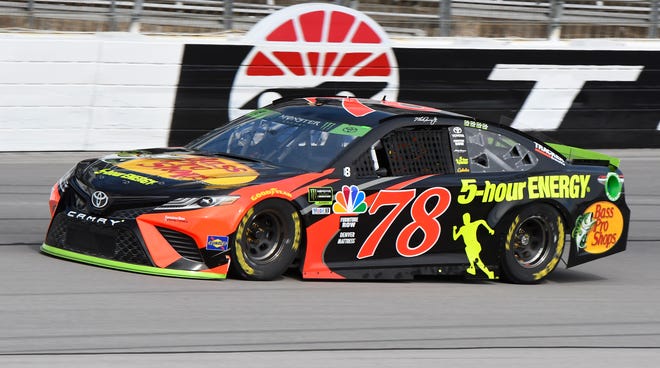 NASCAR Monster Energy Cup Series driver Martin Truex, Jr. drives the Bass Pro Shops/5 Hour ENERGY Toyota in practice at Texas Motor Speedway on Saturday. [AP Photo/Larry Papke]