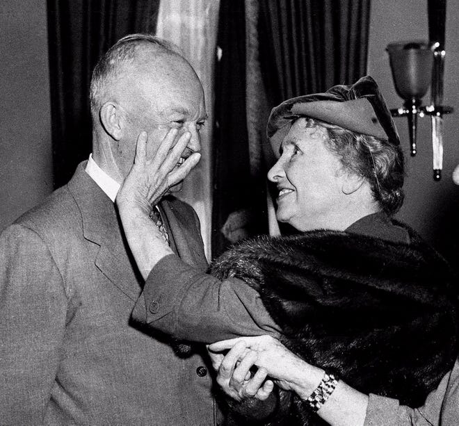 Helen Keller uses her fingers to "see" President Eisenhower in a visit to the White House on Nov. 3, 1953. [The Associated Press]