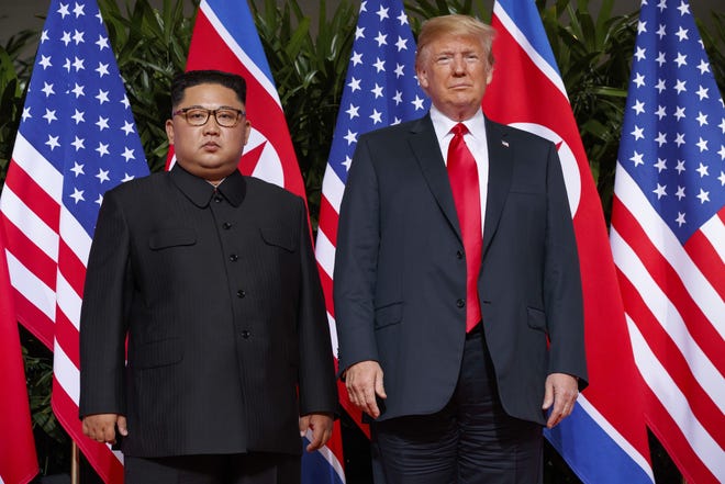 U.S. President Donald Trump, right, meets with North Korean leader Kim Jong Un in Singapore June 12, 2018. [AP Photo/Evan Vucci, File]