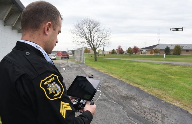 Monroe County Sheriff Sgt. Dave Raymond flies and demonstrates the departments drone outside the Monroe County Animal Control building in Monroe. The first assignment with the drone was where two vehicles and a body were found in Lake Monroe, formerly Francis Stone Quarry. (Monroe News photo by TOM HAWLEY)