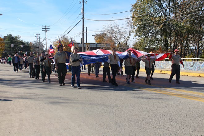 Boy Scout Troop 300 carries the garrison flag down Main St. at the Veterans Day Parade on Sunday, Nov. 4, 2018 in Stroudsburg. [BRIAN MYSZKOWSKI/POCONO RECORD]
