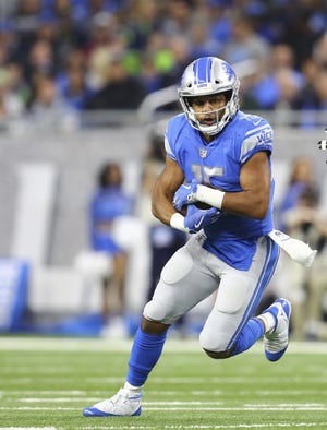 Receiver Golden Tate runs after catching a pass with the Lions during an Oct. 28 game against the Seahawks. [REY DEL RIO/ASSOCIATED PRESS]