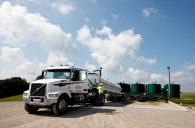A truck unloads in fracking wastewater at an injection well near Cambridge in eastern Ohio. [Kyle Robertson/Dispatch file photo]