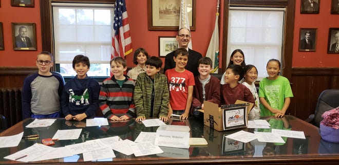 Members of Dens 1, 8 and Webelos 2 of Cub Scout Pack 377 met with Selectmen Chairman Adam Dash at Town Hall for a tour and lesson town government and voting on Oct. 29. [COURTESY PHOTO]