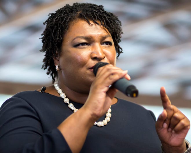 Georgia Democratic gubernatorial candidate Stacey Abrams speaks to supporters at a rally, Monday, Nov., 5, 2018, in Richmond Hill, Ga. Republican candidate Brian Kemp and Abrams are locked in a tight race that could head to a runoff if neither wins a majority Tuesday. (AP Photo/Stephen B. Morton)