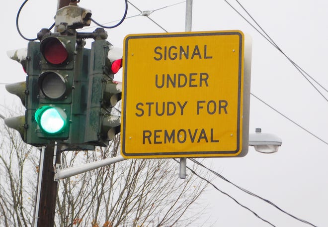 Signs at two Herkimer intersections stating traffic lights there are under study for possible removal are raising concerns among some business owners and village officials. [DONNA THOMPSON/TIMES TELEGRAM]