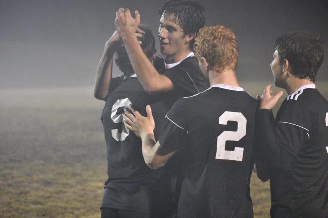 Forestview's Connor Romero embraces teammate Noah Carter after his game-winning goal during Tuesday's second round playoff game against Cuthbertson. [JOE L. HUGHES II/Gazette photo]