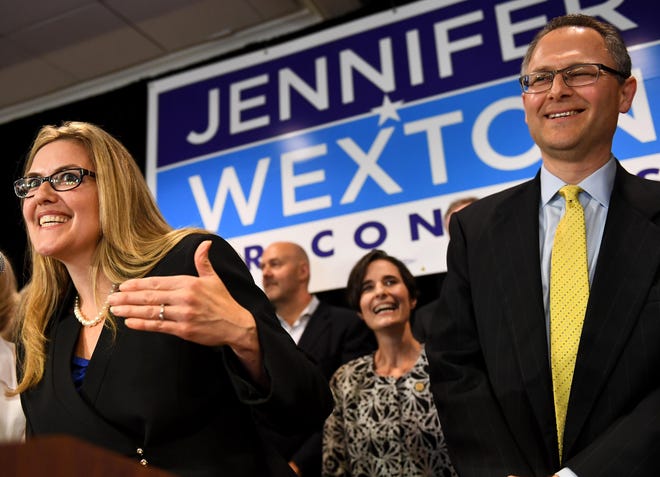 Democrat Jennifer Wexton talks to supporters flanked by her husband, Andrew, Tuesday in Dulles, Virginiaa. Wexton beat incumbent Barbara Comstock in Virginia's 10th congressional district. [Washington Post Photo | Katherine Frey]