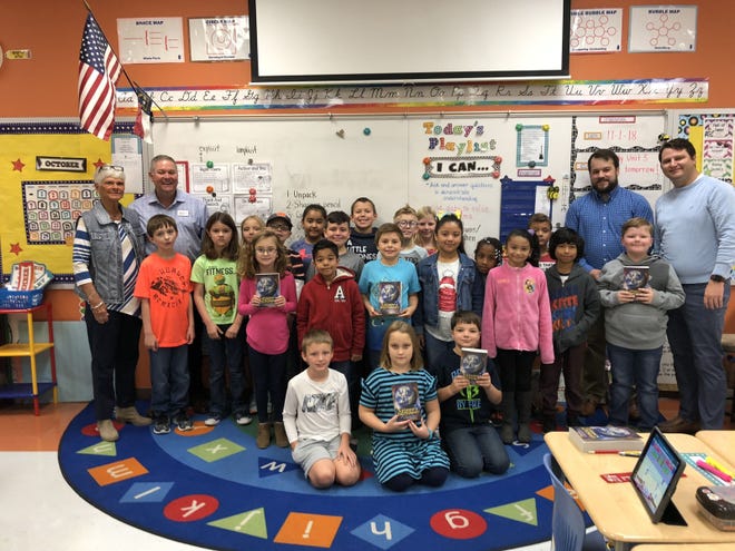 Carol Sykes, Chris Humphrey, Michael Whitfield and Chris Segal from the Kinston noon rotary delivered dictionaries to Pink Hill Elementary School on Thursday, Nov. 1. [Contributed photo]