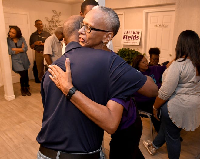 Kay Fields hugs friends and supporters at her victory party in Lakeland on Tuesday after winning re-election to the Polk County School Board.  [SCOTT WHEELER/THE LEDGER]