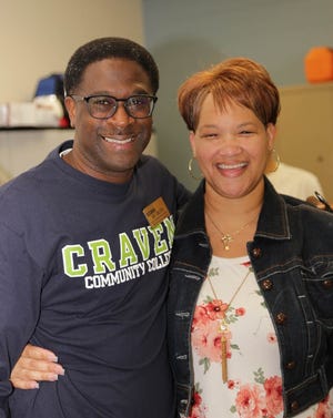 Greg Singleton, Craven CCís director of community workforce readiness, surprises Job Readiness Boot Camp graduate Melinda Becton with a job offer. [CONTRIBUTED PHOTO]