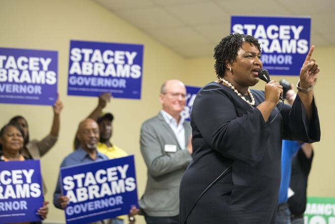 Georgia gubernatorial candidate Stacey Abrams speaks Monday at the Macomber Recreation Building in Rincon, Ga., during a "Get Out The Vote" rally. [Alyssa Pointer/Atlanta Journal-Constitution via AP]