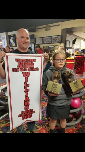 Dennison's Lilah Williams was presented with two Eagle National Champion awards for winning the U10 Girls Bowling.com Youth Open Singles and All Events in July in Fort Worth, Texas. Presenting her with the awards was Charlie Whiteman. Submitted photo