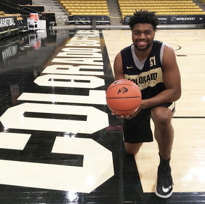 Colorado forward Evan Battey poses on team's court in Boulder. Battey, a redshirt freshman from California, suffered a stroke and two seizures last December and, after 11 months of rehabilitation, is ready to make his on-court debut with the Golden Buffaloes. [AP Photo/Pat Graham]