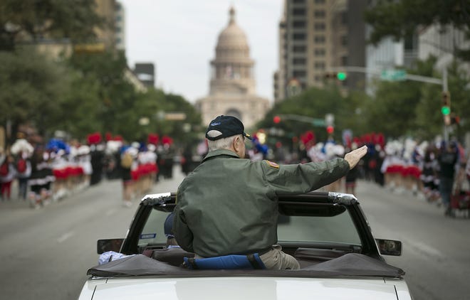 Former Austin Mayor and Naval Commander Lee Leffingwell waves to the parade goers. The Annual Veterans Day Parade was held Saturday morning November 11, 2017 along Congress Avenue from the Ann Richards Bridge to the Texas State Capitol to honor those military veterans who served in the armed forces. 

RALPH BARRERA / AMERICAN-STATESMAN