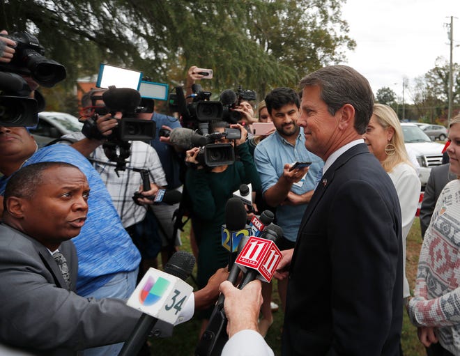 Georgia Republican gubernatorial candidate Brian Kemp speaks to reporters after voting Tuesday, Nov. 6, 2018, in Winterville, Ga. Kemp is in a close race with Democrat Stacey Abrams. (AP Photo/John Bazemore)