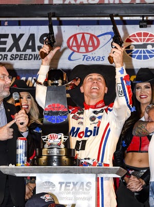 Kevin Harvick celebrates in Victory Lane after winning a NASCAR Cup auto race at Texas Motor Speedway on Sunday in Fort Worth, Texas. [AP Photo/Larry Papke]
