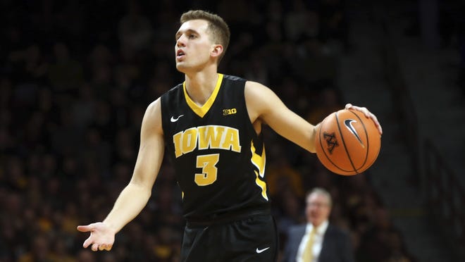 Iowa point guard Jordan Bohannon plans on playing in Thursday's season opener against UMKC despite missing the last two weeks of practice with what coach Fran McCaffery called a 'bone bruise.' [Jim Mone/The Associated Press]
