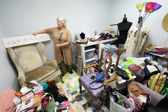 Artist Dottie Scher unpacks in her studio at the new location of the Gaston County Art Guild in an industrial building on East Central Avenue in Mount Holly. [Mike Hensdill/The Gaston Gazette]
