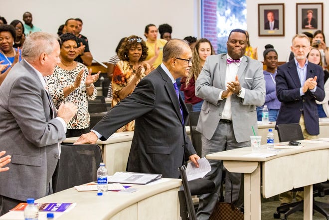 Attendees give a standing ovation for George Starke Jr., the first black student to attend the University of Florida College of Law, during an event celebrating 60 years of desegregation at the University of Florida on Wednesday. [Lauren Bacho/Staff Photographer]